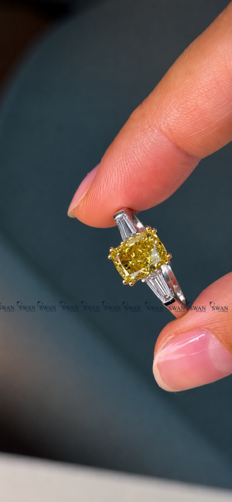 IGI Certified Vivid Yellow Cushion Cut Three Stone Engagement Ring With Side Baguette Stone