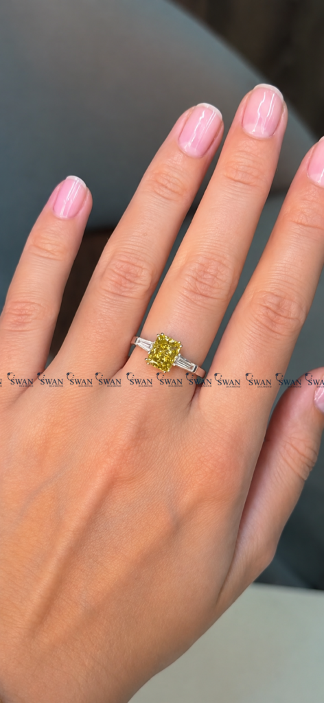 IGI Certified Vivid Yellow Cushion Cut Three Stone Engagement Ring With Side Baguette Stone