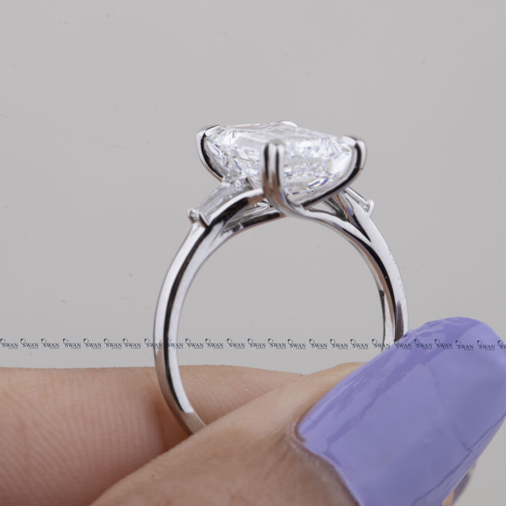 Three Stone Emerald Cut Lab Grown Diamond Engagement Ring With Unique Heart Prong Side Baguette Diamond