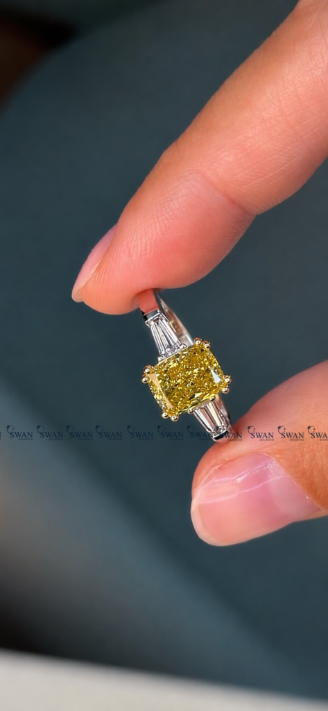 IGI Certified Vivid Yellow Cushion Cut Three Stone Engagement Ring With Side Baguette Stone