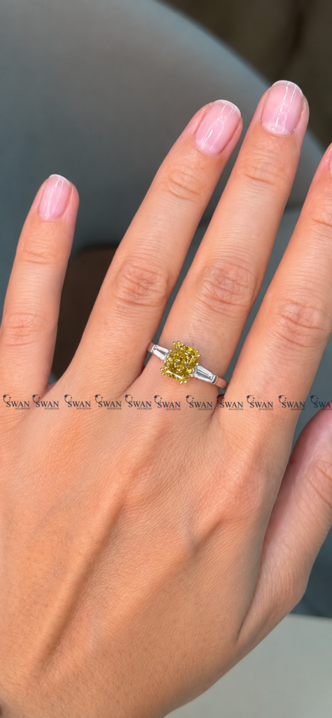 IGI Certified Vivid Yellow Cushion Cut Three Stone Engagement Ring With Side Baguette Stone
